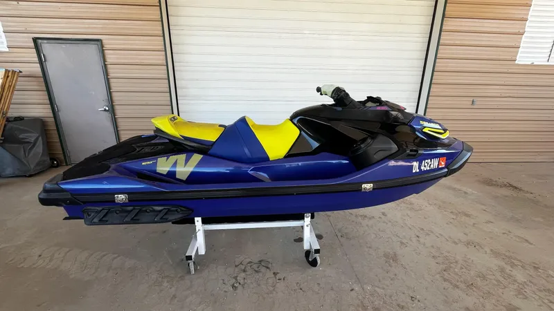 Slide: The Image of 2021 Sea-Doo Wake Pro 230 jet ski in a garage setting. - 7