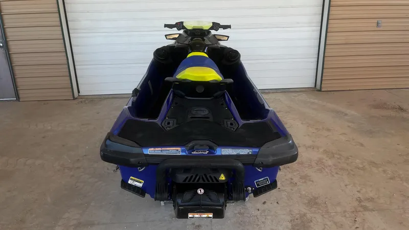Slide: The Image of 2021 Sea-Doo Wake Pro 230 jet ski, rear view in a garage setting. - 8