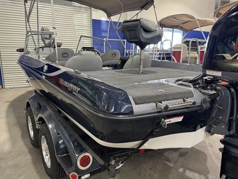 Slide: The Image of 2018 Ranger 212LS boat on trailer in indoor showroom. - 11