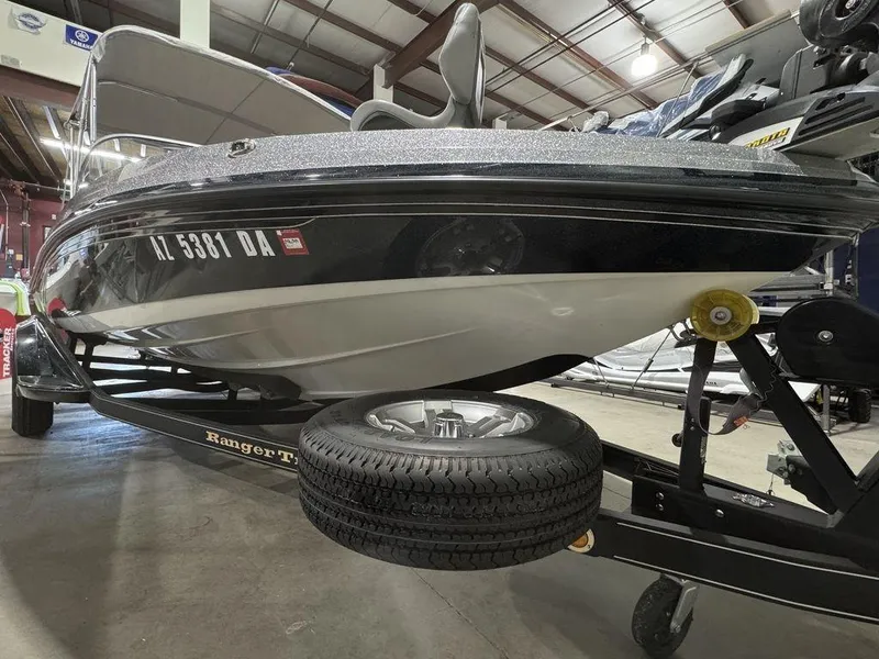 Slide: The Image of 2018 Ranger 212LS boat on trailer in indoor storage facility. - 21