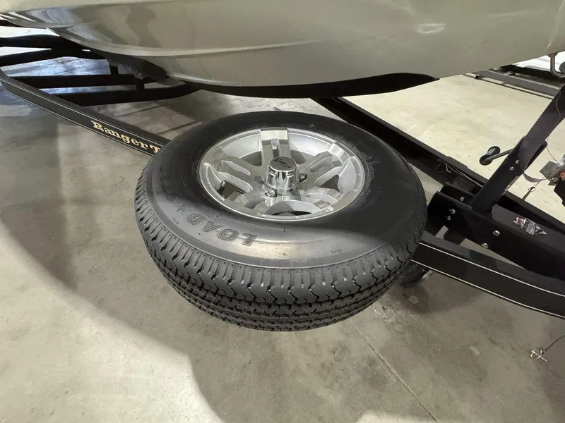 Slide: The Image of 2018 Ranger 212LS boat trailer with spare tire in a garage setting. - 22