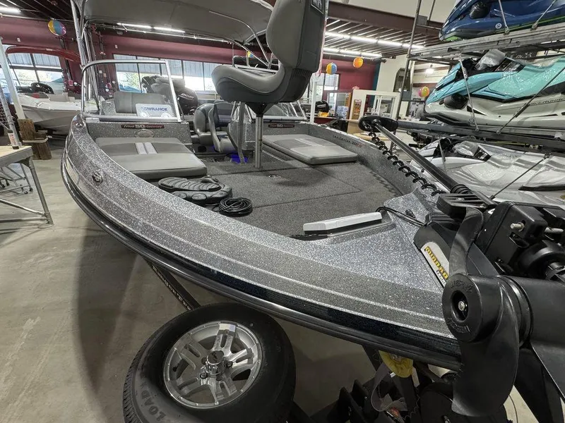 Slide: The Image of 2018 Ranger 212LS boat in showroom, featuring sleek design and modern seating. - 24