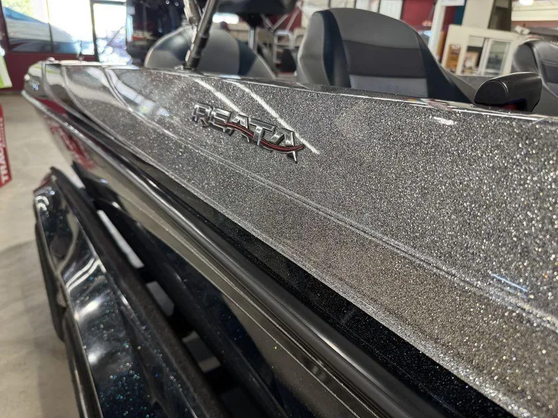 Slide: The Image of 2018 Ranger 212LS boat with sparkling exterior finish in showroom. - 28
