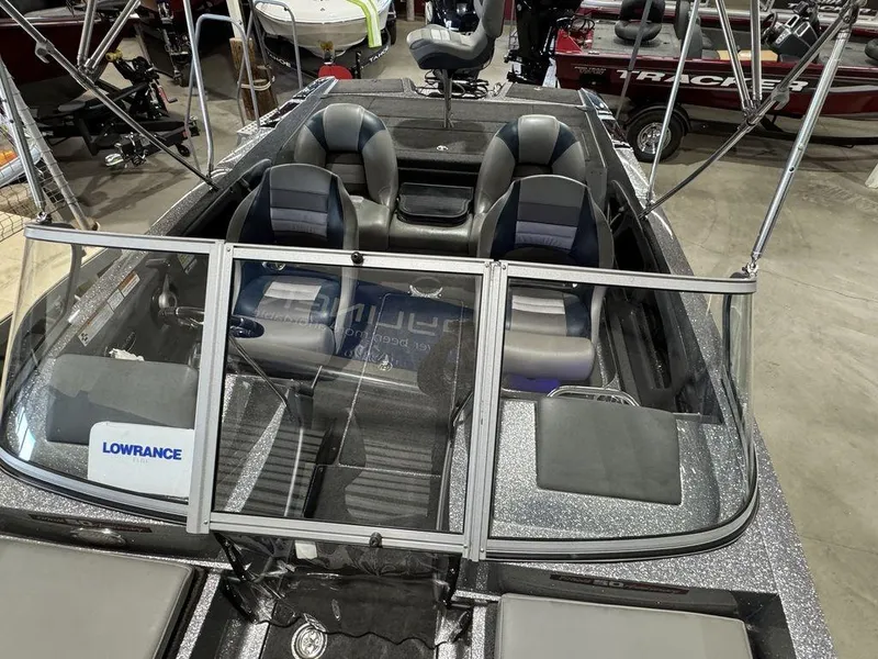 Slide: The Image of 2018 Ranger 212LS boat interior with seating and Lowrance equipment. - 30