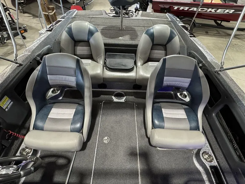 Slide: The Image of 2018 Ranger 212LS boat interior with four cushioned seats and storage compartments. - 32