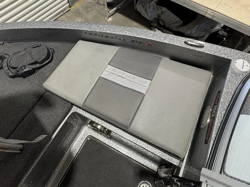 Slide: The Image of 2018 Ranger 212LS boat interior with gray seating and storage compartments. - 33