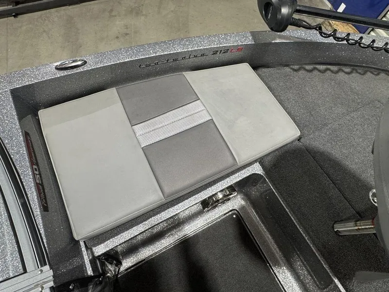 Slide: The Image of 2018 Ranger 212LS boat interior with gray cushioned seating and carpeted flooring. - 35