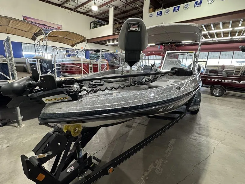Slide: The Image of 2018 Ranger 212LS boat in showroom, featuring sleek design and modern equipment. - 4