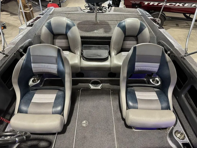 Slide: The Image of 2018 Ranger 212LS boat interior with four cushioned seats and storage compartments. - 42
