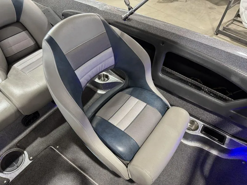 Slide: The Image of 2018 Ranger 212LS boat interior with gray and blue seating. - 43