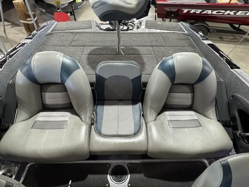 Slide: The Image of 2018 Ranger 212LS boat interior with three gray and blue seats. - 44