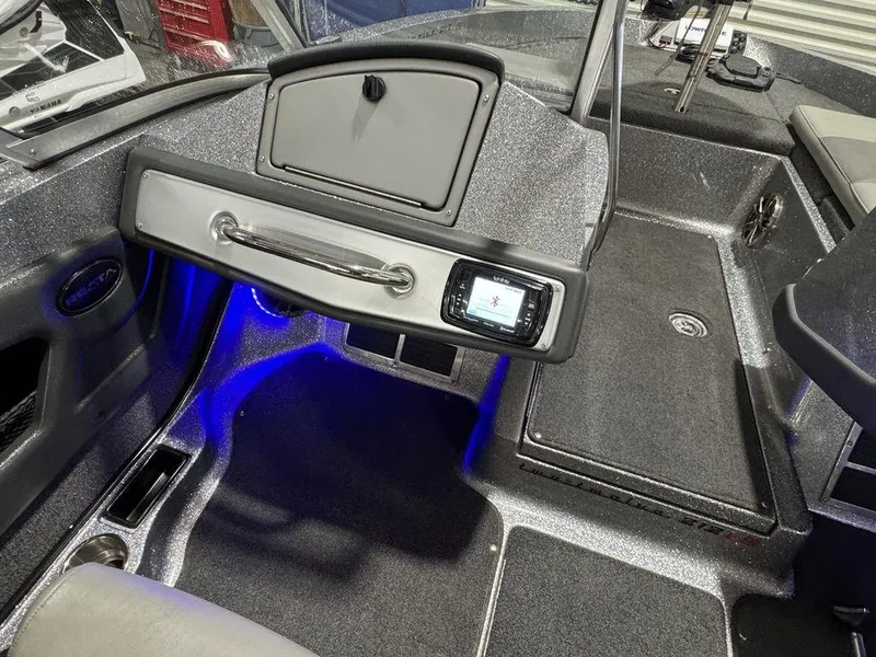 Slide: The Image of 2018 Ranger 212LS boat interior with blue LED lighting and dashboard controls. - 49