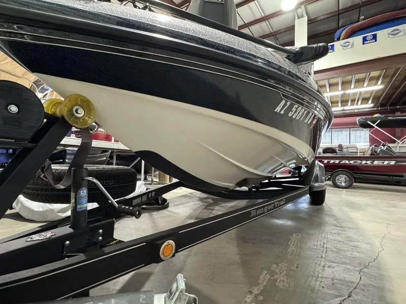 Slide: The Image of 2018 Ranger 212LS boat on trailer in indoor showroom. - 5