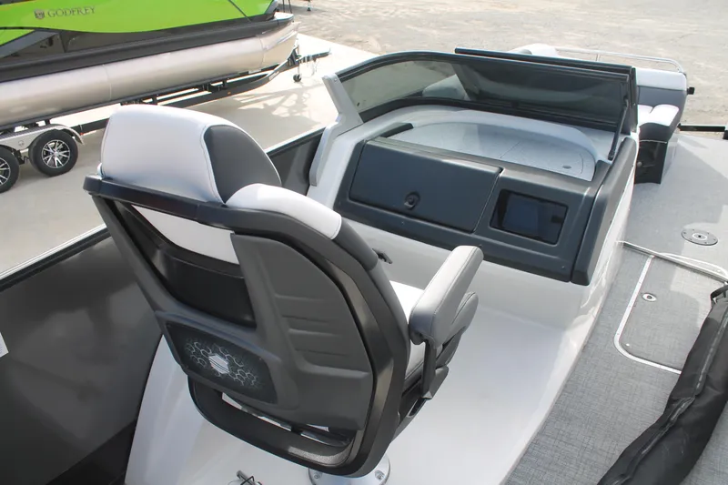 Slide: The Image of 2024 South Bay 25 Sport CR9-DC boat interior with modern helm and seating. - 10