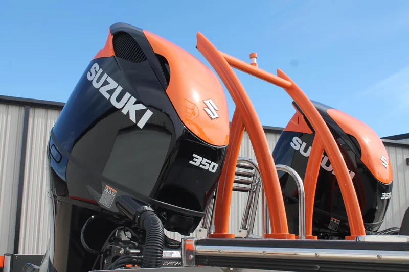Slide: The Image of Twin Suzuki 350 outboard motors on a 2024 South Bay 25 Sport CR9-DC boat. - 12