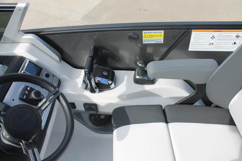 Slide: The Image of 2024 South Bay 25 Sport CR9-DC boat cockpit with steering wheel and controls. - 6