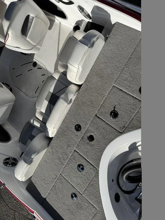 Slide: The Image of 2018 Nitro Z19 Sport boat interior with gray seating and storage compartments. - 11