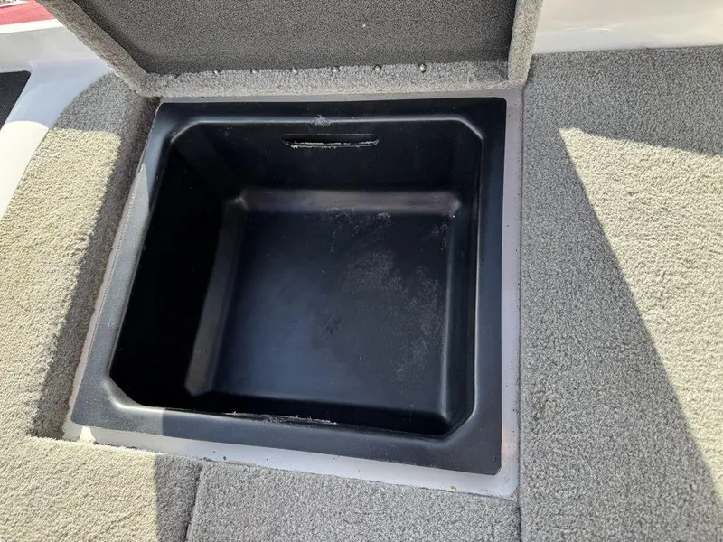Slide: The Image of Open storage compartment in 2018 Nitro Z19 Sport boat. - 14