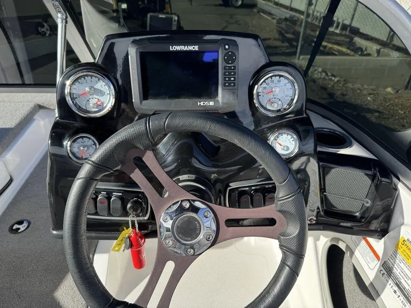 Slide: The Image of 2018 Nitro Z19 Sport dashboard with steering wheel and Lowrance HDS display. - 16