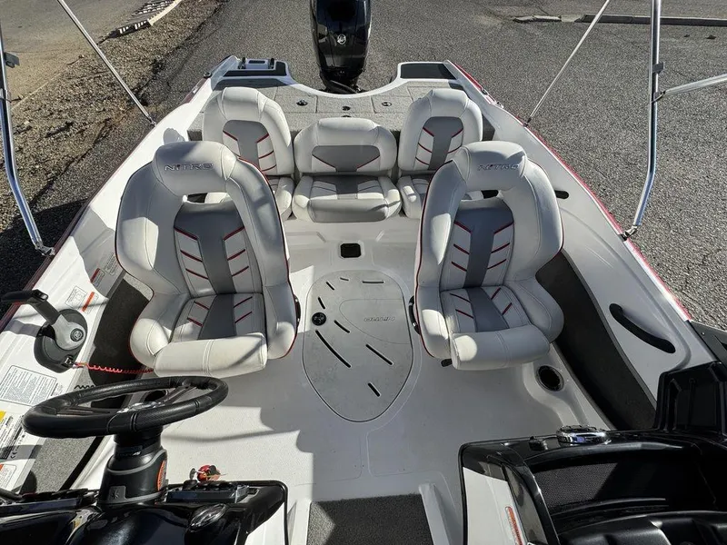 Slide: The Image of 2018 Nitro Z19 Sport boat interior with four cushioned seats and steering wheel. - 29