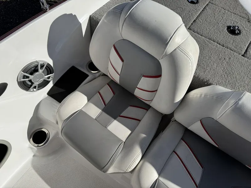 Slide: The Image of 2018 Nitro Z19 Sport boat interior with cushioned seats and speaker. - 30