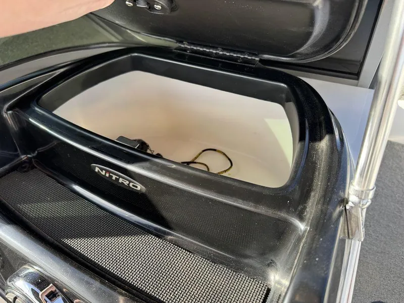 Slide: The Image of Open storage compartment of 2018 Nitro Z19 Sport boat. - 33