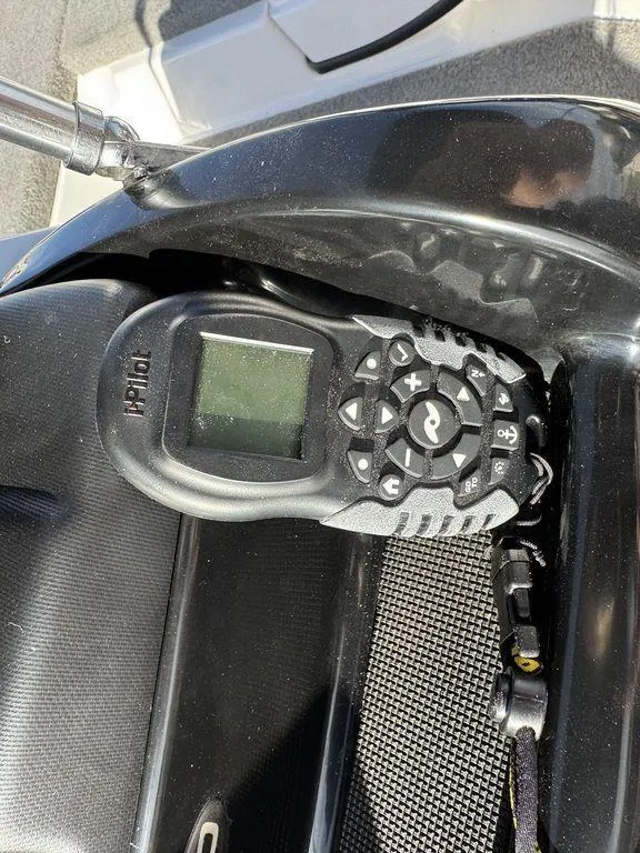 Slide: The Image of Control panel of a 2018 Nitro Z19 Sport boat, featuring a digital display and buttons. - 34