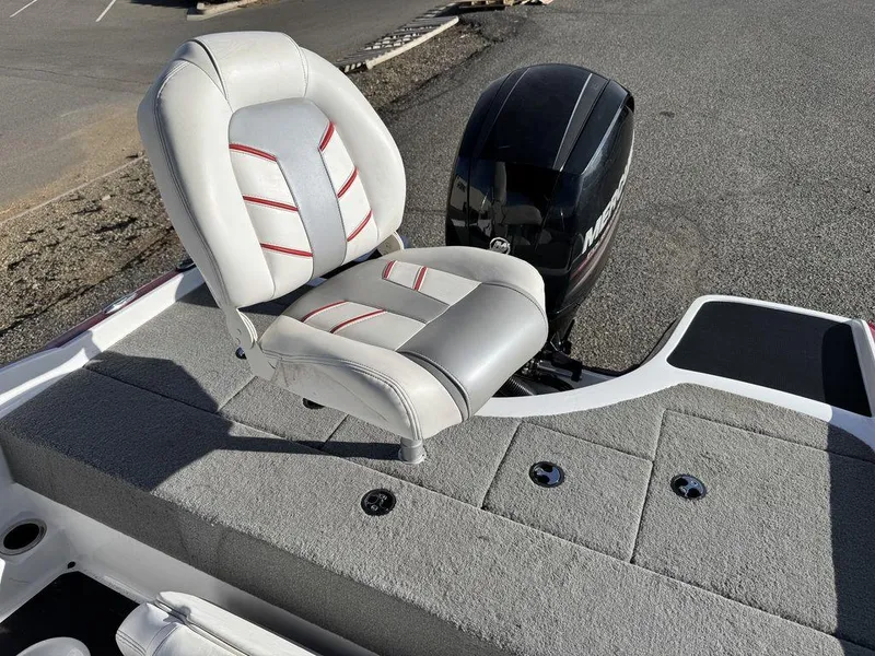 Slide: The Image of 2018 Nitro Z19 Sport boat with cushioned seat and Mercury outboard motor. - 36
