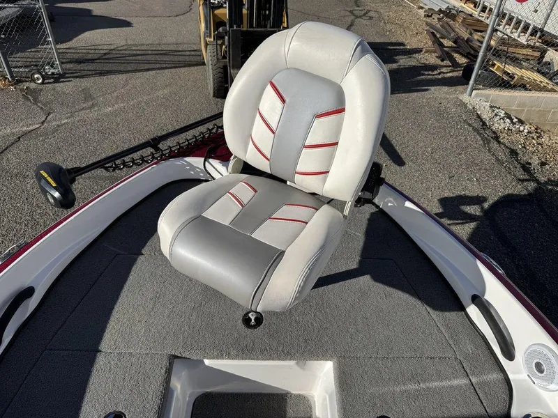 Slide: The Image of 2018 Nitro Z19 Sport boat seat with gray and red accents on deck. - 39
