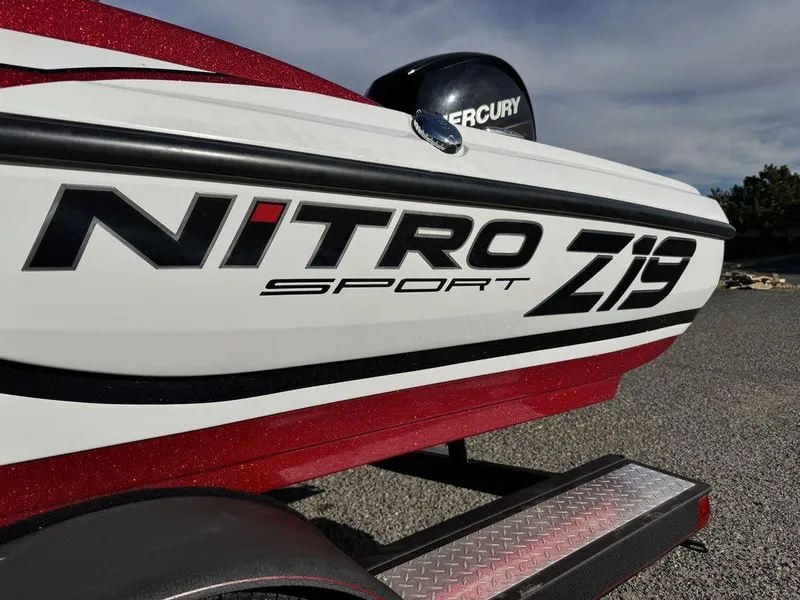 Slide: The Image of 2018 Nitro Z19 Sport boat with Mercury engine, parked on a trailer. - 8