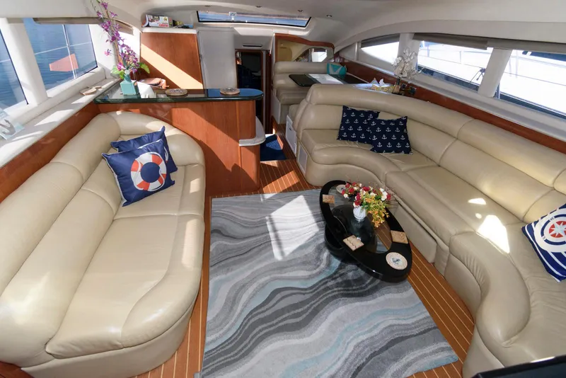 Slide: The Image of Luxurious interior of a 2002 Sea Ray 480 Motor Yacht with elegant seating and decor. - 13