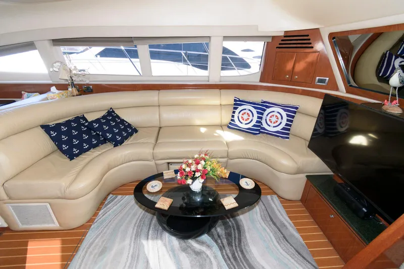 Slide: The Image of Luxurious interior of 2002 Sea Ray 480 Motor Yacht with plush seating and elegant decor. - 14
