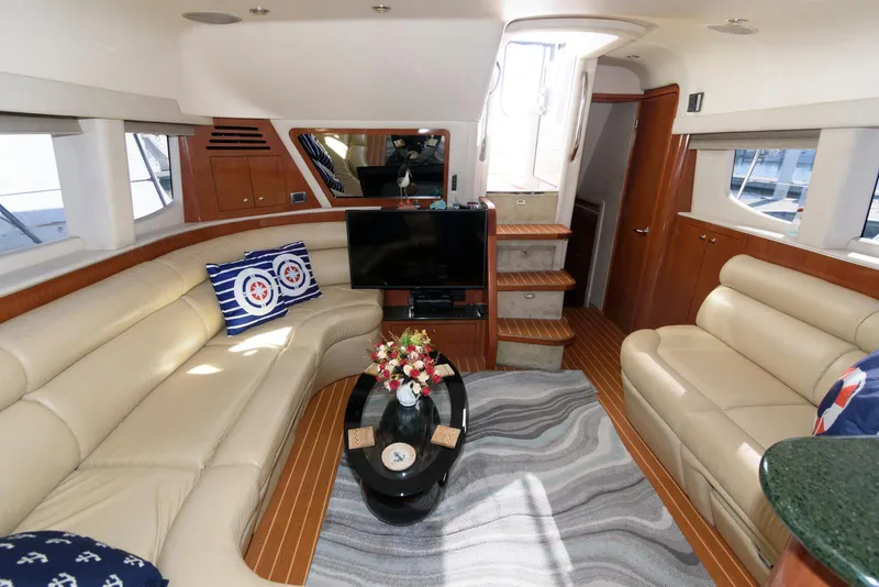 Slide: The Image of Luxurious interior of 2002 Sea Ray 480 Motor Yacht with plush seating and modern amenities. - 16