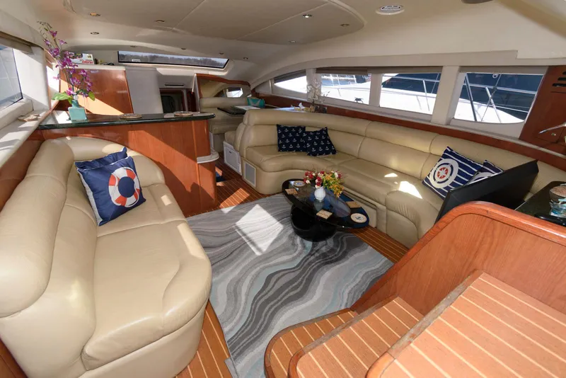 Slide: The Image of Luxurious interior of 2002 Sea Ray 480 Motor Yacht with plush seating and elegant decor. - 17
