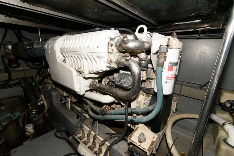 Slide: The Image of Engine room of 2002 Sea Ray 480 Motor Yacht, showcasing mechanical components and systems. - 26
