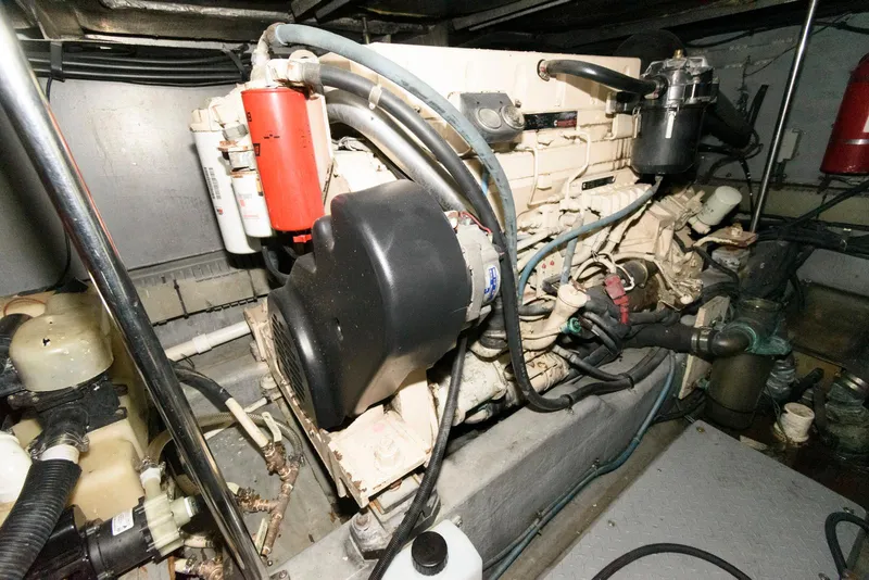 Slide: The Image of Engine room of 2002 Sea Ray 480 Motor Yacht, showcasing mechanical components and systems. - 27