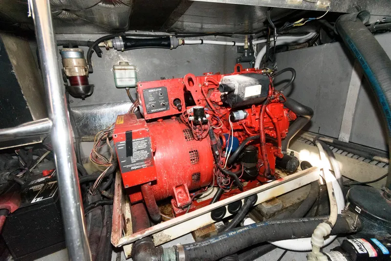 Slide: The Image of Engine room of 2002 Sea Ray 480 Motor Yacht with red generator. - 28