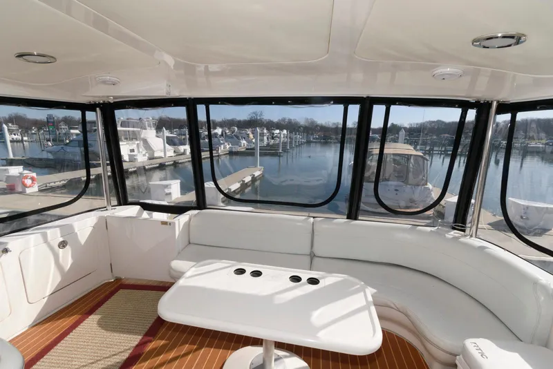 Slide: The Image of Interior of 2002 Sea Ray 480 Motor Yacht with marina view through large windows. - 8