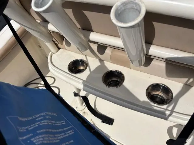 Slide: The Image of 2022 Scout 215 XSF boat interior with rod holders and cup holders. - 36