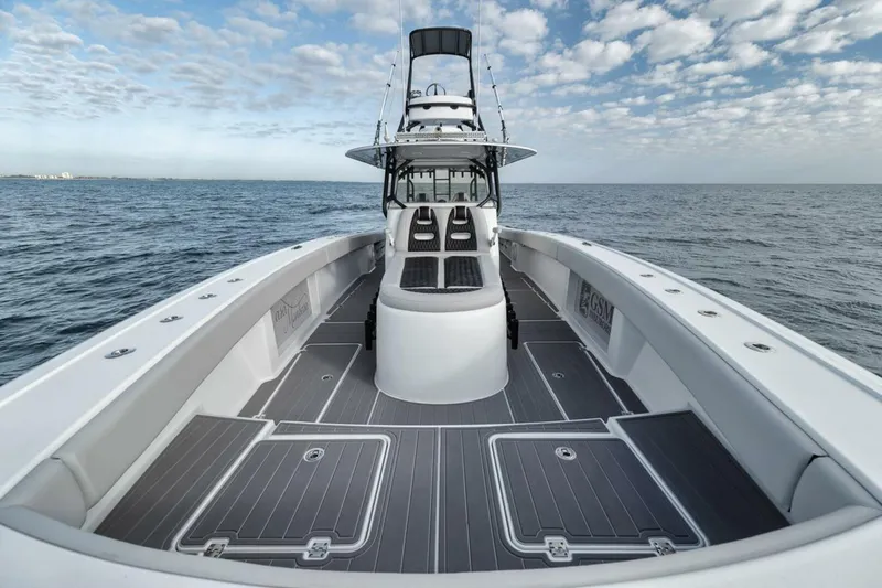 Slide: The Image of 2019 Freeman 42LR boat on open sea with spacious deck and clear sky. - 13
