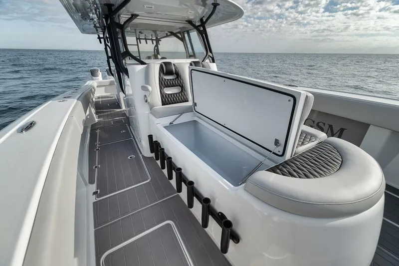 Slide: The Image of 2019 Freeman 42LR boat with open storage, sleek design, and ocean backdrop. - 18