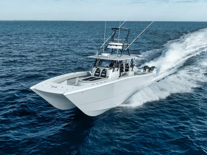 Slide: The Image of 2019 Freeman 42LR boat cruising on open ocean waters. - 2