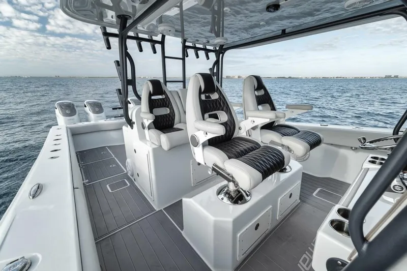 Slide: The Image of 2019 Freeman 42LR boat interior with luxury seating on open water. - 20
