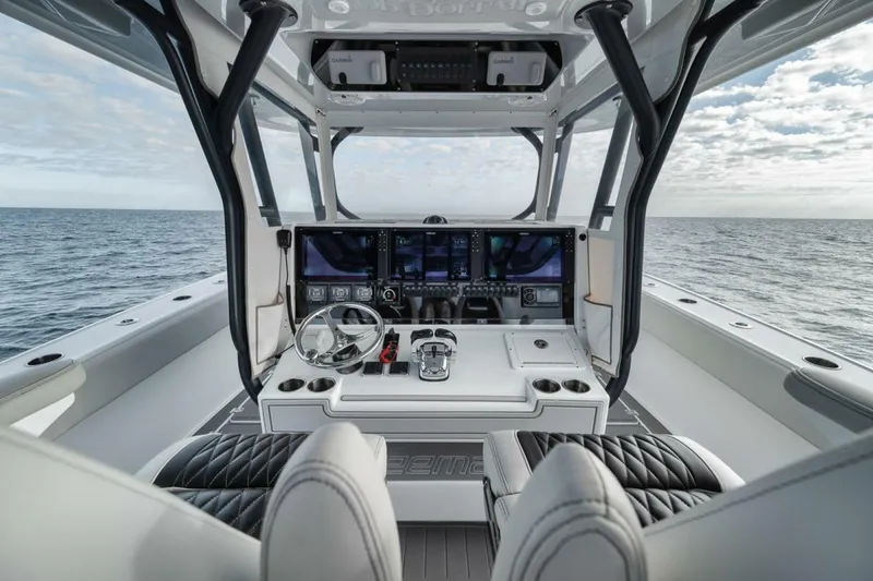 Slide: The Image of Luxurious 2019 Freeman 42LR boat cockpit with advanced navigation system, overlooking the ocean. - 22