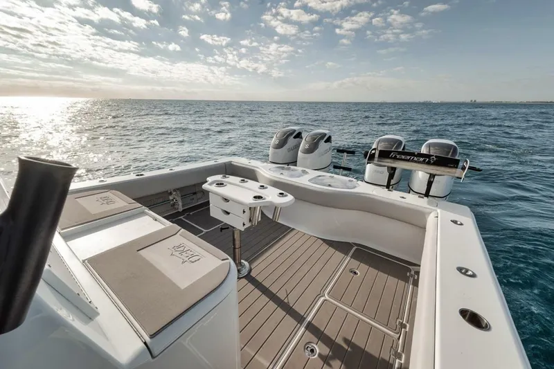 Slide: The Image of 2019 Freeman 42LR boat deck with twin engines on open sea. - 26
