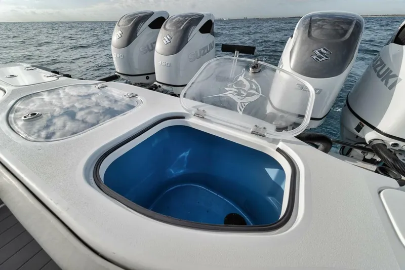 Slide: The Image of Open livewell on 2019 Freeman 42LR boat with Suzuki outboard motors in the ocean. - 29