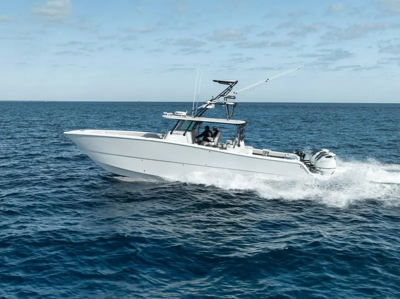 Slide: The Image of 2019 Freeman 42LR boat cruising on open ocean under clear sky. - 3