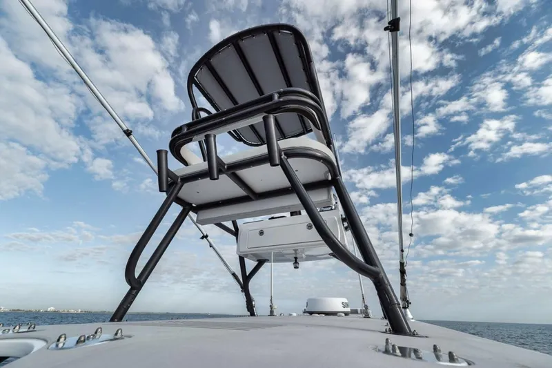Slide: The Image of 2019 Freeman 42LR boat with elevated seating against a cloudy sky backdrop. - 34
