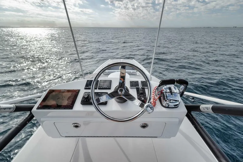 Slide: The Image of Helm of 2019 Freeman 42LR boat with ocean view and clear sky. - 36