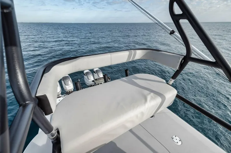Slide: The Image of 2019 Freeman 42LR boat with cushioned seating, overlooking ocean waters. - 39